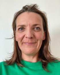 Headshot of Emma smiling at the camera.