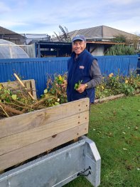 Papa Tere, volunteer working in the garden