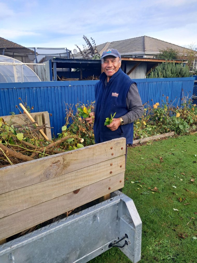 Papa Tere, volunteer working in the garden